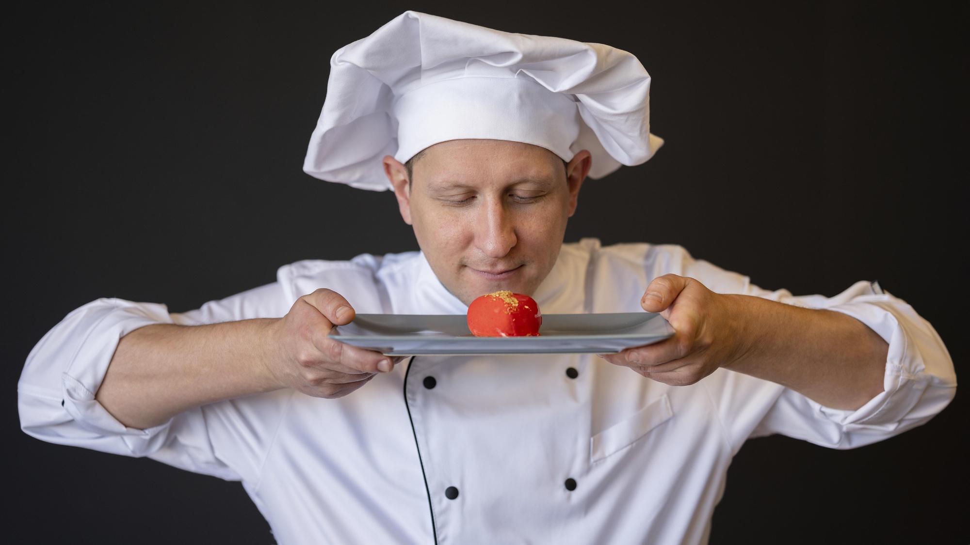 Instructor demonstrating plating technique in a quiet studio